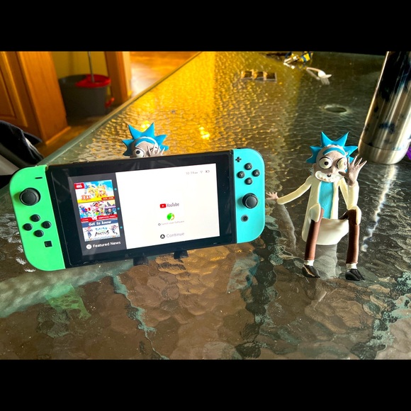 Rick and Morty phone holder also is compatible with iPad and Nintendo switch. - Picture 1 of 3